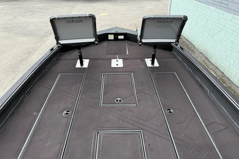 Slide: The Image of 2026 SeaArk Flex 21 Pro boat deck with open storage compartments. - 7