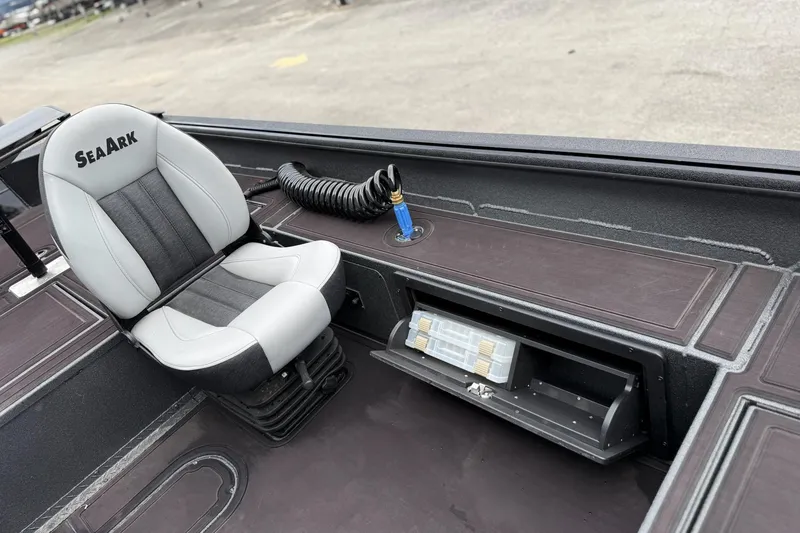 Slide: The Image of 2026 SeaArk Flex 21 Pro boat interior with seat and storage compartment. - 9