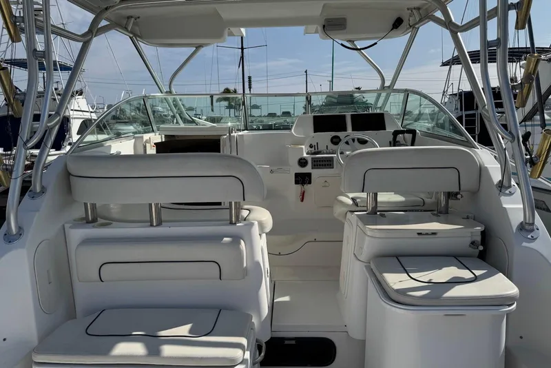 Slide: The Image of 2007 Wellcraft 290 Coastal boat interior with helm, seating, and controls. - 12