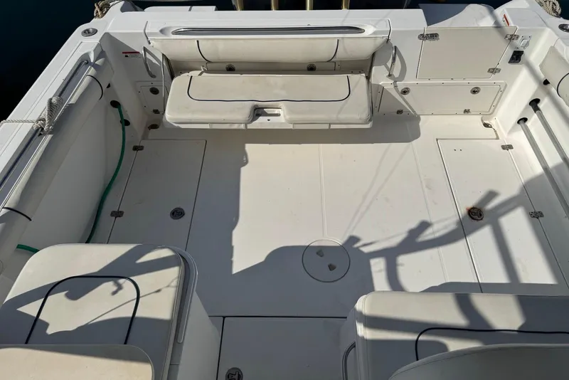 Slide: The Image of 2007 Wellcraft 290 Coastal boat deck with seating and storage compartments. - 13