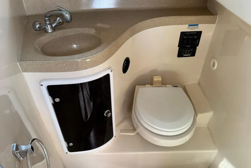 Slide: The Image of 2007 Wellcraft 290 Coastal boat bathroom with sink and toilet. - 18