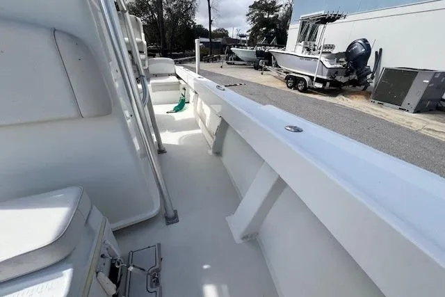 Slide: The Image of 2016 Parker 21SE Center Console boat, side view, docked with other boats nearby. - 10