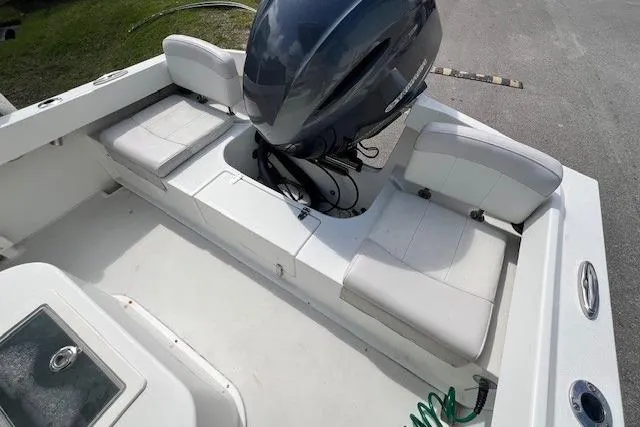 Slide: The Image of 2016 Parker 21SE Center Console boat interior with seating and outboard motor. - 12