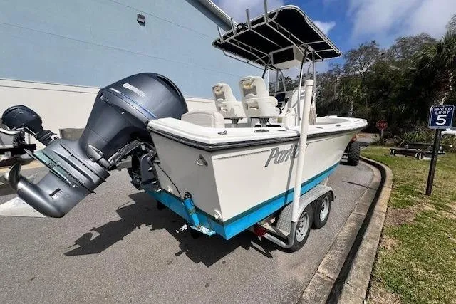 Slide: The Image of 2016 Parker 21SE Center Console boat on trailer, parked outdoors. - 15