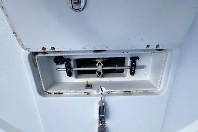 Slide: The Image of 2016 Parker 21SE Center Console boat compartment with latch and hardware details. - 7