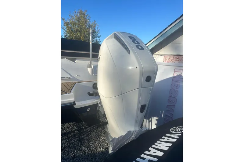 Slide: The Image of 2023 Sea Ray SPX 230 Outboard with Yamaha engine, parked outdoors. - 14
