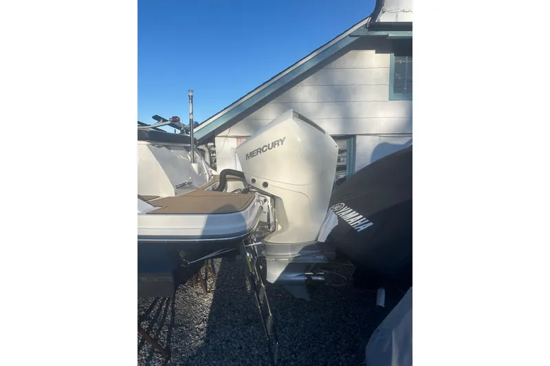 Slide: The Image of 2023 Sea Ray SPX 230 Outboard with Mercury engine, parked outdoors. - 15