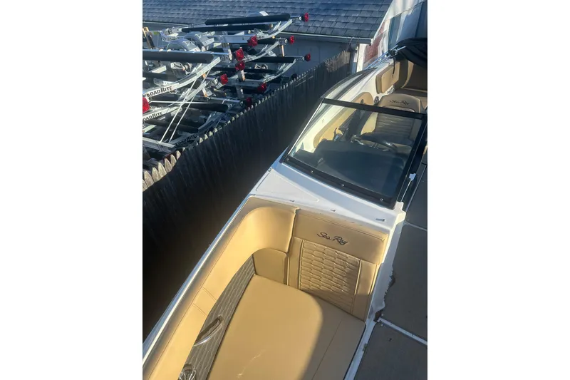 Slide: The Image of 2023 Sea Ray SPX 230 Outboard boat with tan interior and sleek design. - 26