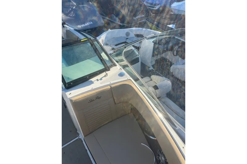 Slide: The Image of 2023 Sea Ray SPX 230 Outboard boat interior with seating and windshield. - 27