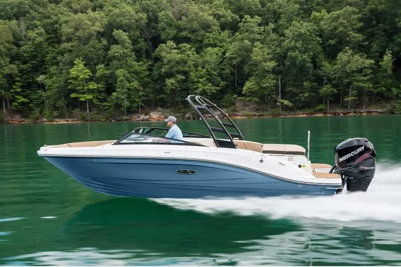 Slide: The Image of 2023 Sea Ray SPX 230 Outboard cruising on a serene lake with lush forest backdrop. - 3