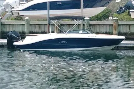 Slide: The Image of 2023 Sea Ray SPX 230 Outboard boat docked in marina, side view. - 7
