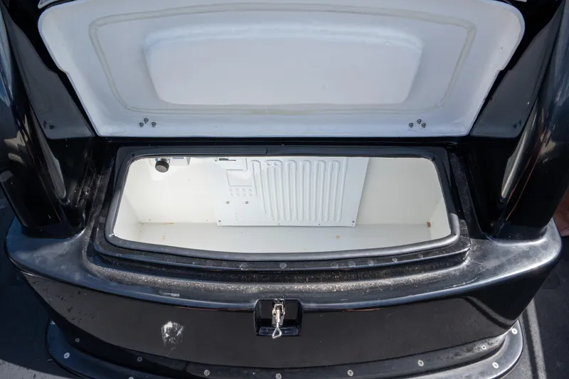 Slide: The Image of Open storage compartment of 2023 Sea Water PHANTOM 280 boat, featuring a sleek black exterior. - 12