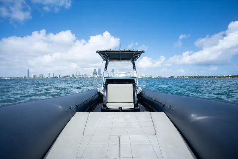 Slide: The Image of 2023 Sea Water PHANTOM 280 boat cruising on blue ocean with city skyline. - 16