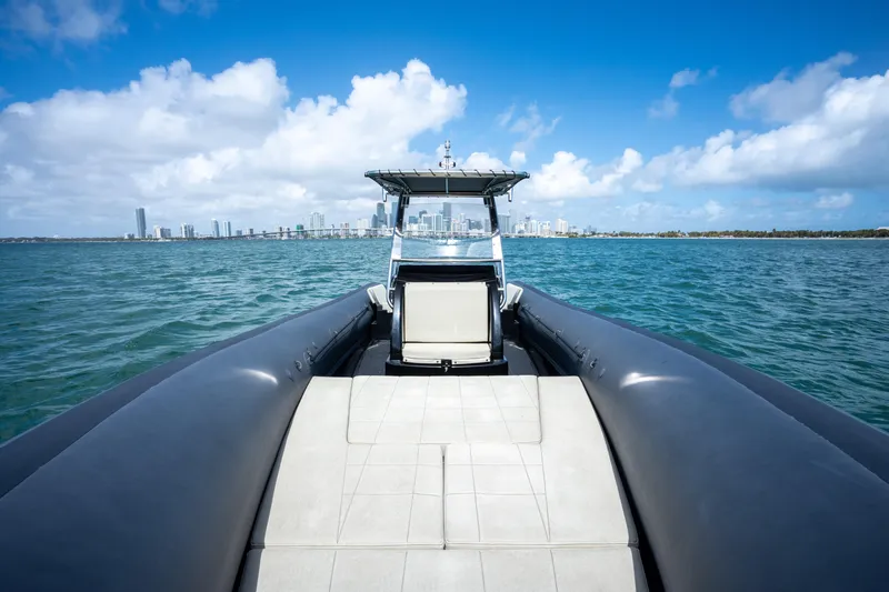 Slide: The Image of 2023 Sea Water PHANTOM 280 boat cruising on blue ocean with city skyline. - 17