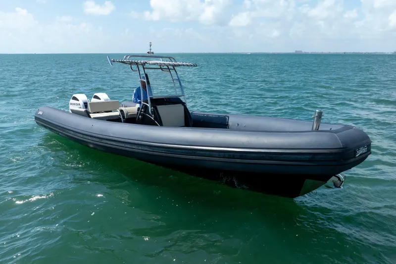 Slide: The Image of 2023 Sea Water PHANTOM 280 boat on open water, featuring dual Honda engines. - 18