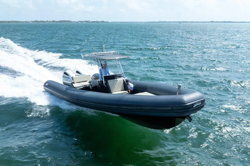 Slide: The Image of 2023 Sea Water PHANTOM 280 boat cruising on open sea with dual Honda engines. - 21
