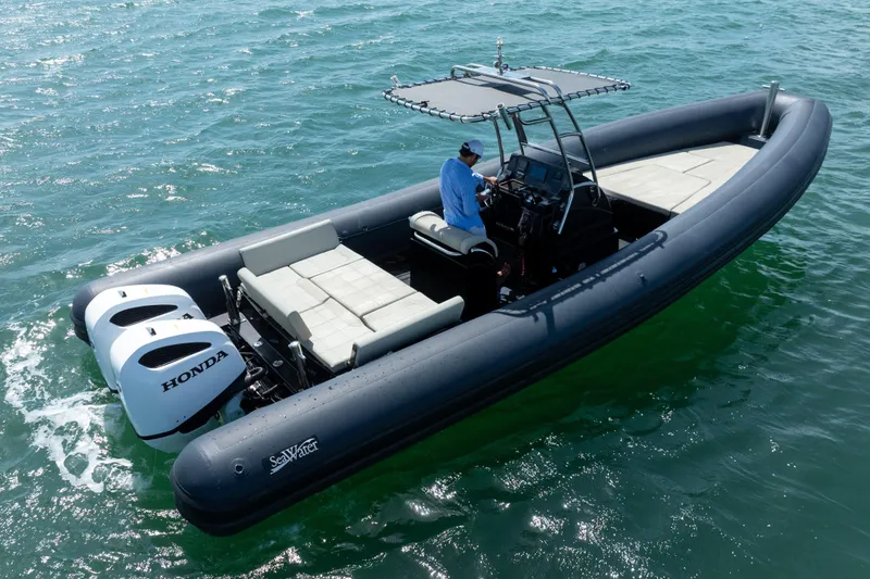Slide: The Image of 2023 Sea Water PHANTOM 280 boat with Honda engines on open water. - 9