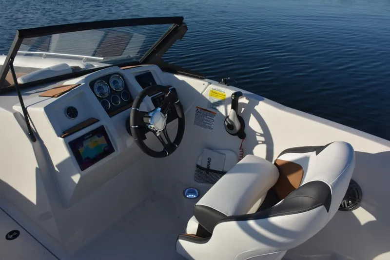 Slide: The Image of 2026 Starcraft SVX 210 DC OB boat with Suzuki outboard motor at a boat show. - 13