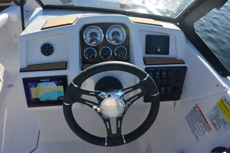 Slide: The Image of 2026 Starcraft SVX 210 DC OB boat deck with Suzuki outboard motor. - 14