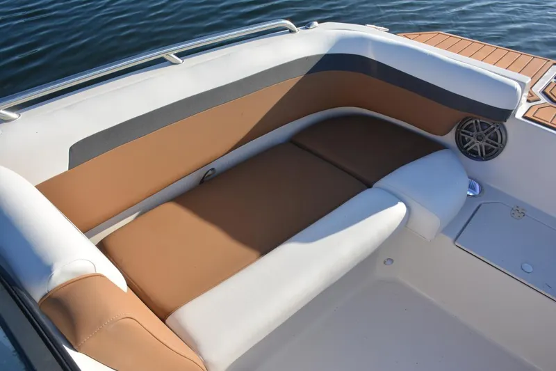 Slide: The Image of 2026 Starcraft SVX 210 DC OB boat dashboard with steering wheel and control panel. - 17