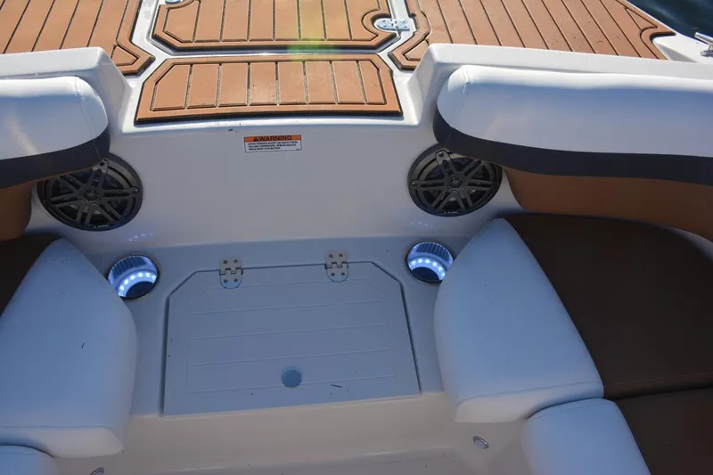 Slide: The Image of 2026 Starcraft SVX 210 DC OB boat seating, featuring sleek white and gray upholstery. - 18