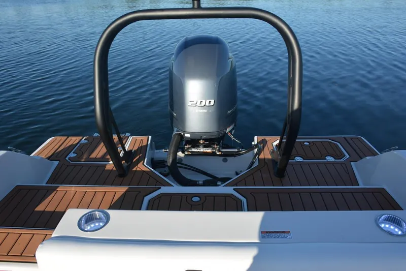 Slide: The Image of 2026 Starcraft SVX 210 DC OB boat seating, featuring sleek white and black upholstery. - 19