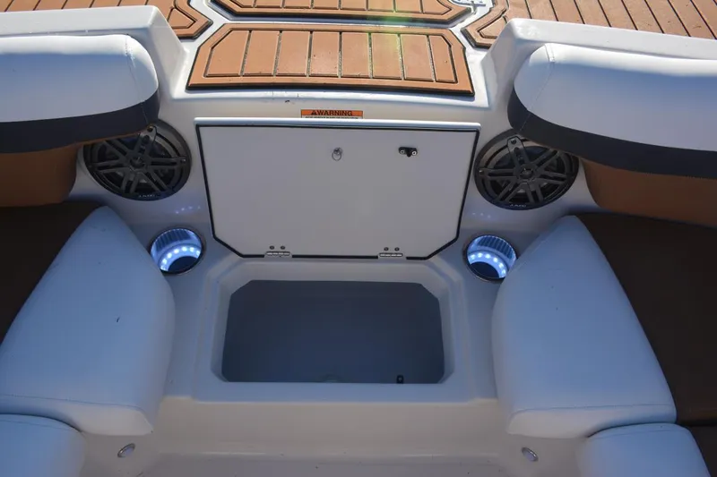 Slide: The Image of 2026 Starcraft SVX 210 DC OB boat cruising with passengers on calm water. - 20