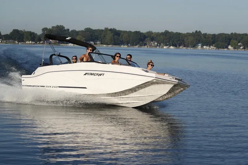 Slide: The Image of Interior of 2026 Starcraft SVX 210 DC OB boat with modern seating and dashboard. - 7