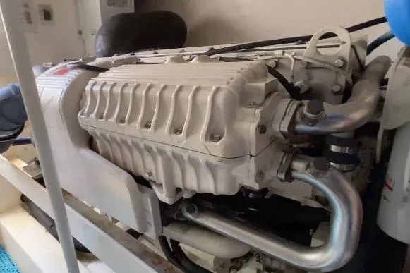 Slide: The Image of 2006 Luhrs 41 Open yacht interior with white cabinetry and teak flooring. - 12