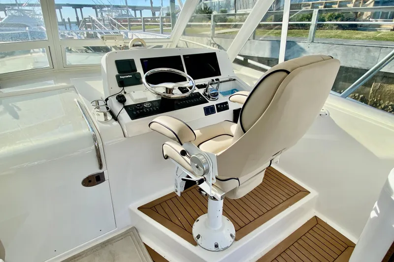 Slide: The Image of Helm station of 2006 Luhrs 41 Open yacht with modern controls and comfortable captain's chair. - 16