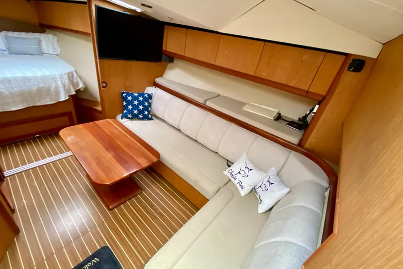 Slide: The Image of Luxurious interior of 2006 Luhrs 41 Open yacht with cozy seating and elegant wood finishes. - 18