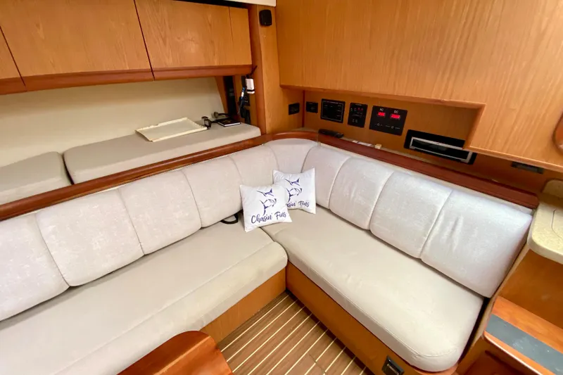 Slide: The Image of Luxurious interior of 2006 Luhrs 41 Open yacht with comfortable seating and elegant wood finish. - 22