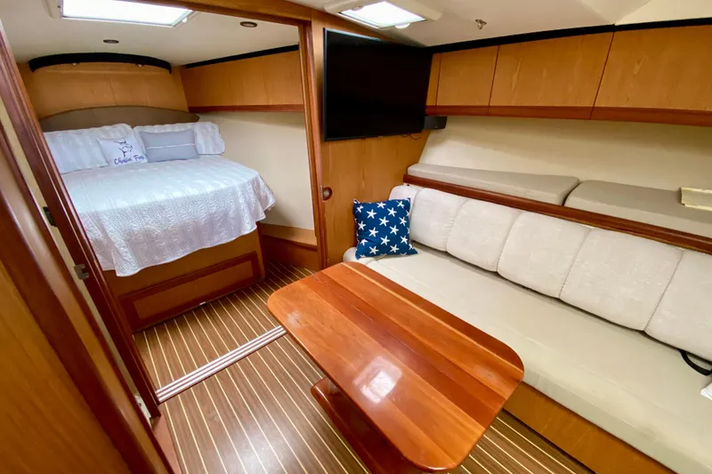 Slide: The Image of Luxurious interior of 2006 Luhrs 41 Open yacht with cozy bed and seating area. - 23