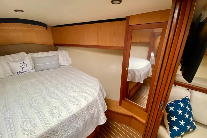 Slide: The Image of Luxurious cabin interior of 2006 Luhrs 41 Open yacht with cozy bedding. - 25