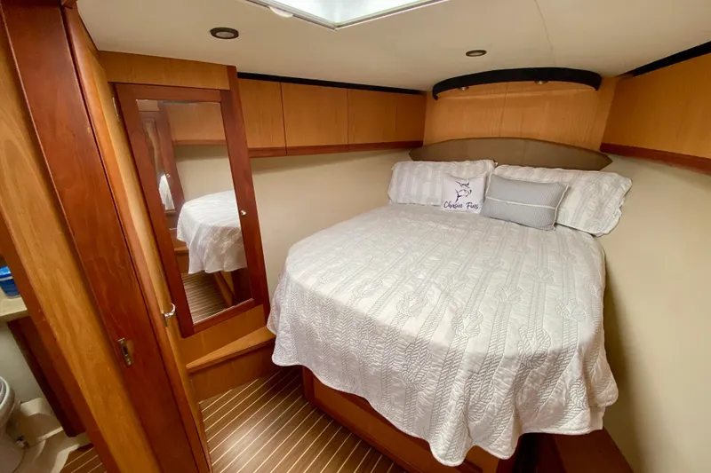Slide: The Image of Luxurious cabin interior of 2006 Luhrs 41 Open yacht with cozy bedding. - 26
