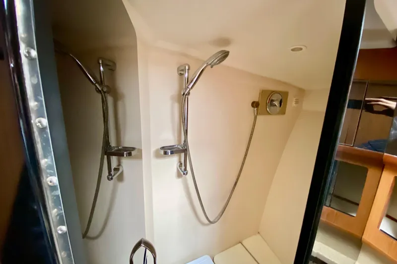 Slide: The Image of Shower area in 2006 Luhrs 41 Open yacht, featuring dual showerheads and modern fixtures. - 29