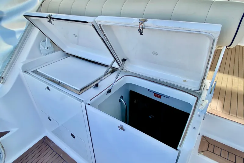 Slide: The Image of Open storage compartments on a 2006 Luhrs 41 Open boat deck. - 35