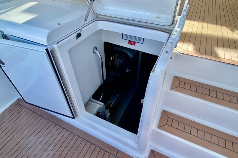 Slide: The Image of 2006 Luhrs 41 Open boat engine compartment with open hatch and teak deck. - 37