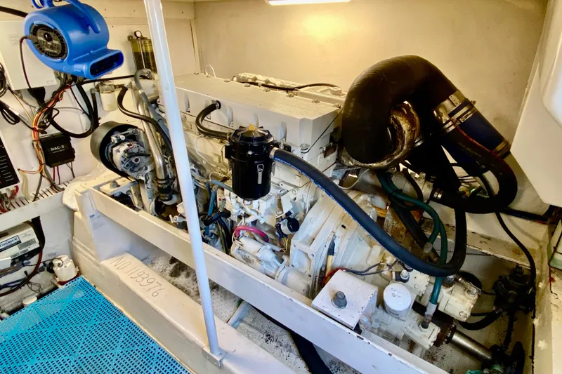 Slide: The Image of Engine room of 2006 Luhrs 41 Open boat, showcasing detailed mechanical components. - 39