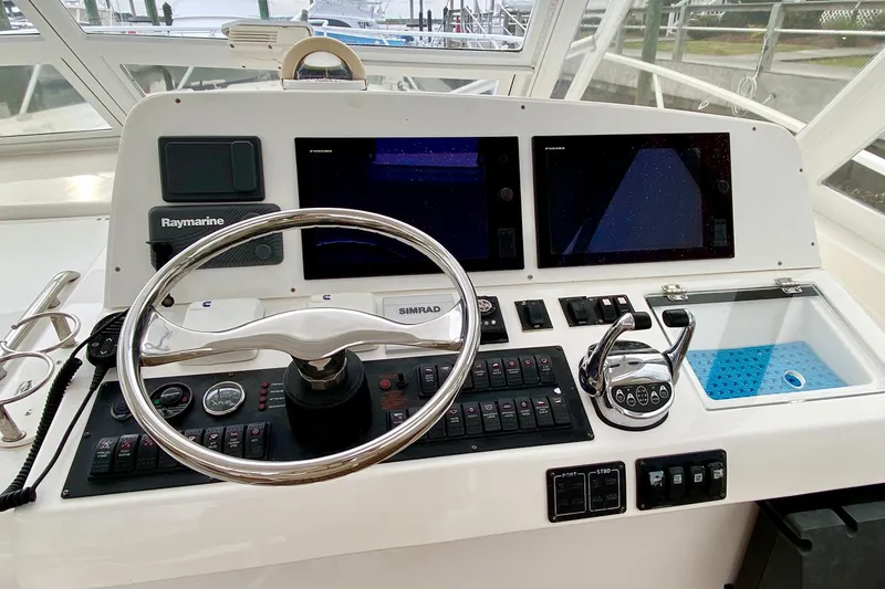 Slide: The Image of Helm of 2006 Luhrs 41 Open boat with navigation controls and displays. - 4