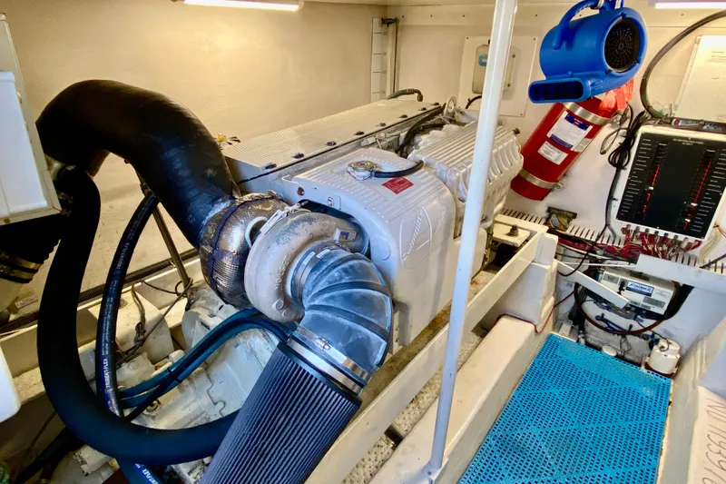 Slide: The Image of Engine room of 2006 Luhrs 41 Open boat, featuring mechanical components and safety equipment. - 40