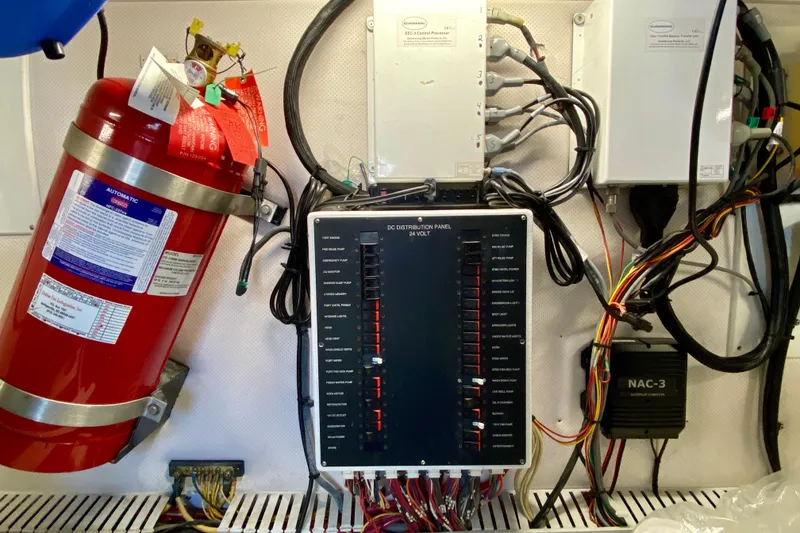 Slide: The Image of Electrical panel and fire extinguisher in 2006 Luhrs 41 Open boat engine room. - 41