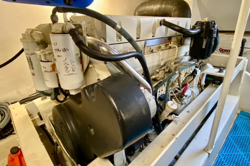 Slide: The Image of Engine compartment of a 2006 Luhrs 41 Open boat, showcasing detailed machinery components. - 42