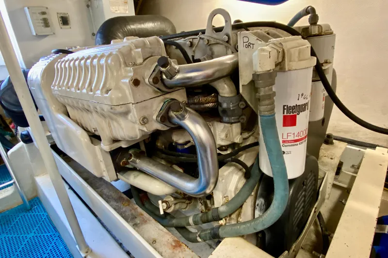 Slide: The Image of Engine compartment of a 2006 Luhrs 41 Open boat, featuring Fleetguard filters. - 43