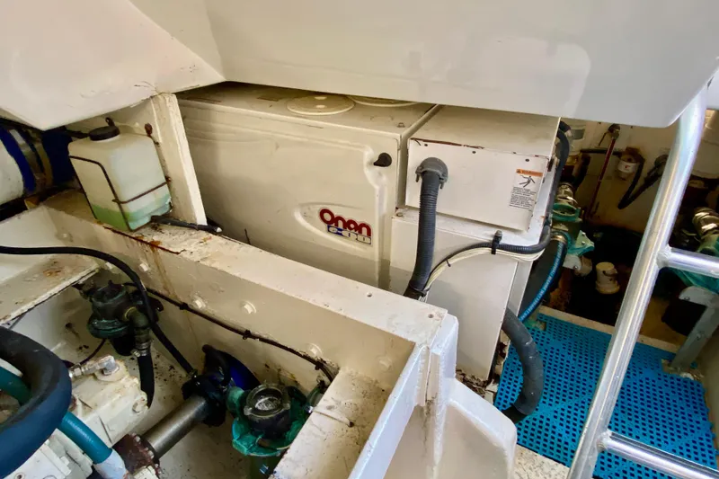 Slide: The Image of Engine room of 2006 Luhrs 41 Open boat featuring Onan generator. - 44