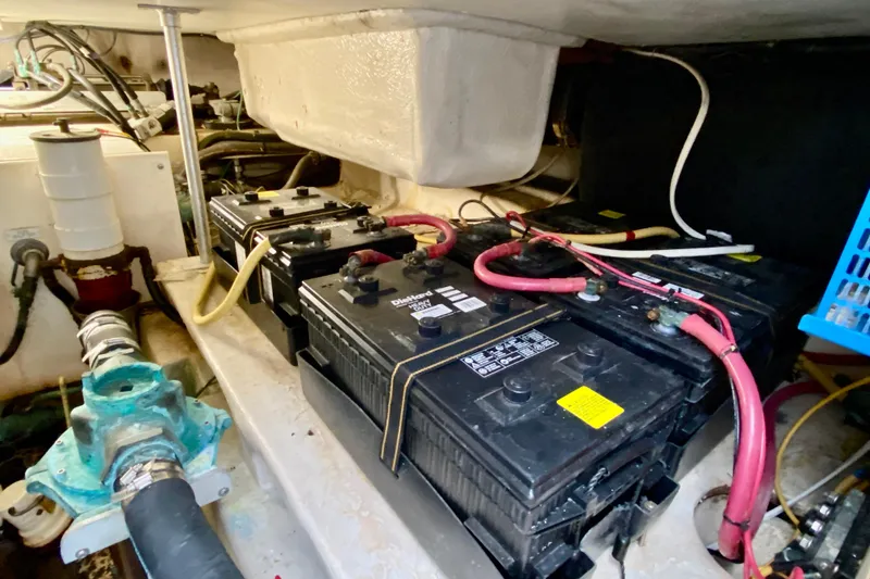 Slide: The Image of Battery compartment of a 2006 Luhrs 41 Open boat with wiring and components. - 46