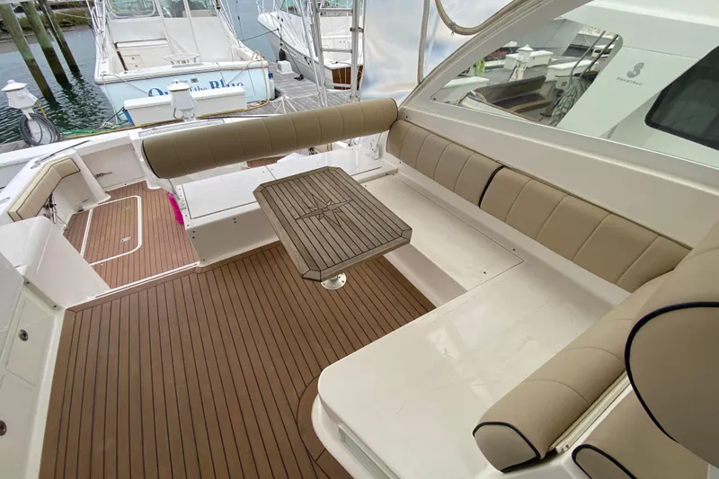 Slide: The Image of 2006 Luhrs 41 Open boat interior with seating and fishing chair. - 6