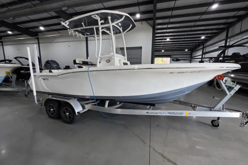 The Image of 2022 Tidewater boat on trailer in indoor showroom, side view. - 1