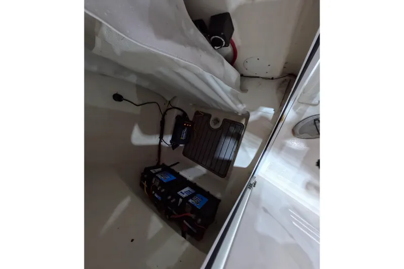 Slide: The Image of 2022 Tidewater boat interior showing battery setup and wiring. - 11