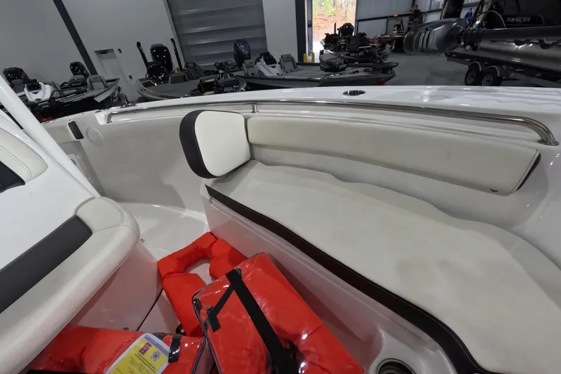 Slide: The Image of Interior of a 2022 Tidewater boat with seating and life jackets in a showroom. - 12